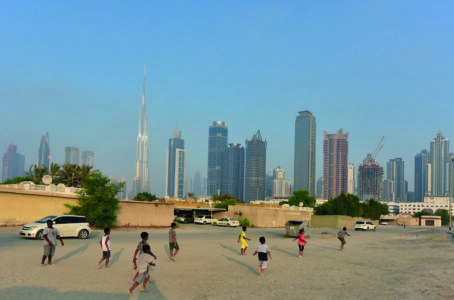 Children playing soccer on sandy street outside the
boundaries of bigness. Image courtesy National
Pavilion UAE – la Biennale di Venezia.